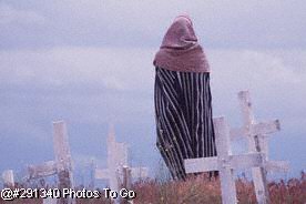 Woman standing in cemetery